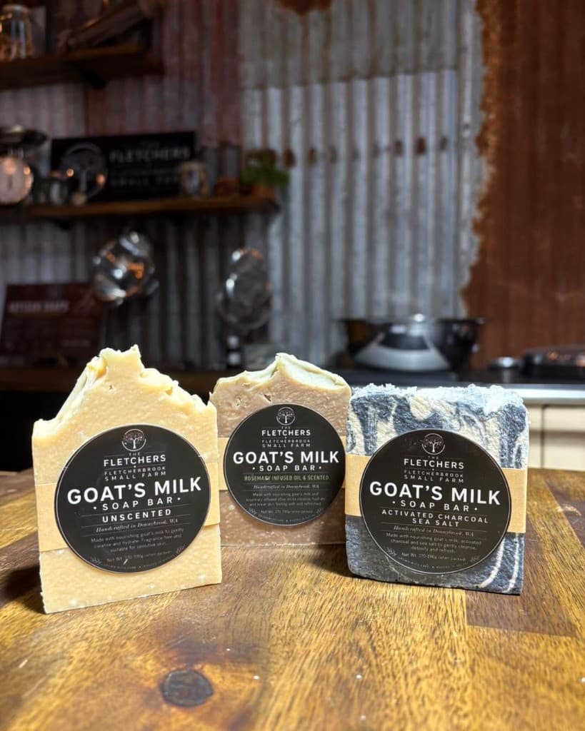 Three Fletchers goat's milk soap bars: unscented, rosemary, and activated charcoal sea salt